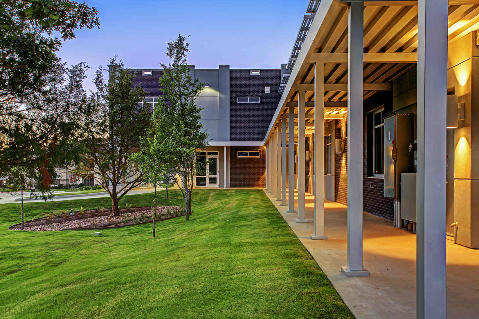 Side view of a commercial building with landscaped green space in Houston, TX, completed by GSD Construction Side view of a commercial building with landscaped green space in Houston, TX, completed by GSD Construction